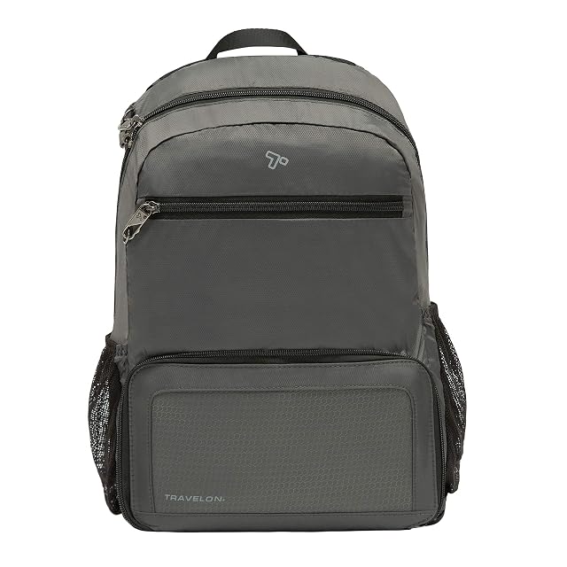 Travelon Anti-Theft Active packable backpack folded into its own pouch beside the open bag