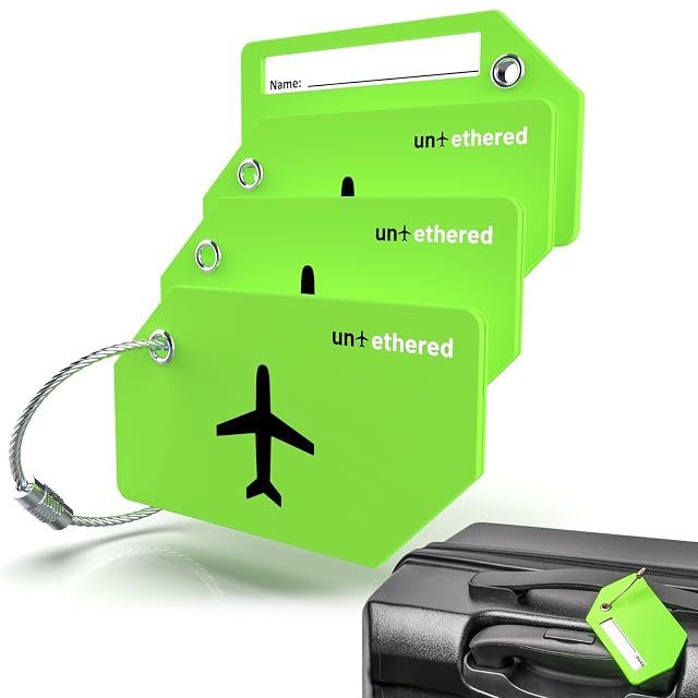 Untethered bright green silicone luggage tags with their stainless steel loops