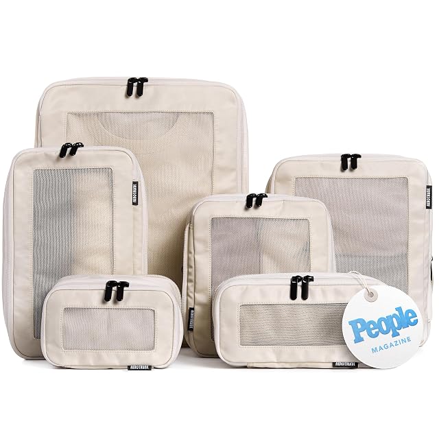 Aerotrunk compression packing cubes in beige with their mesh top panels
