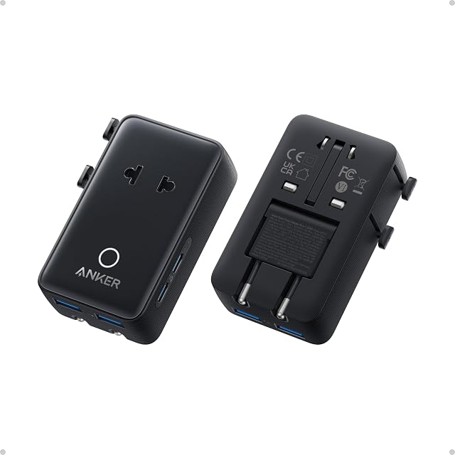 Anker Nano travel adapter beside a credit card for scale, pins retracted