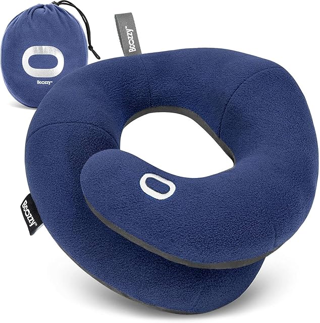 BCOZZY double-support travel neck pillow in navy with its arms overlapped under the chin