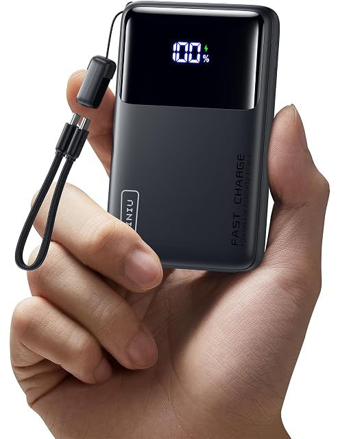 INIU P61-E1 power bank standing on its built-in phone stand with a phone propped on it