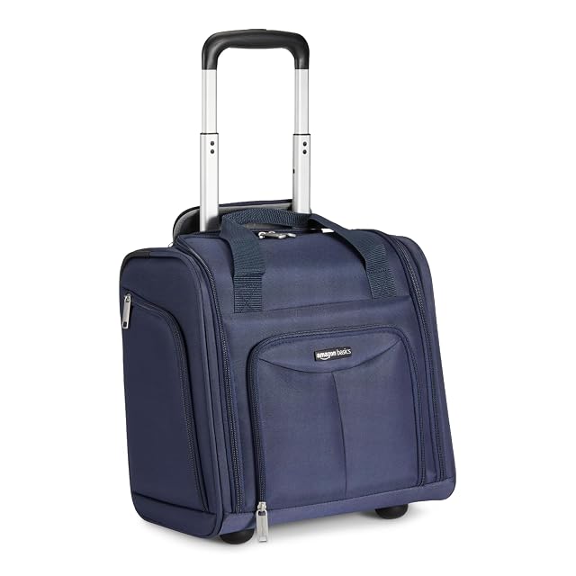 Amazon Basics 14 inch underseat rolling travel bag in navy with its handle extended